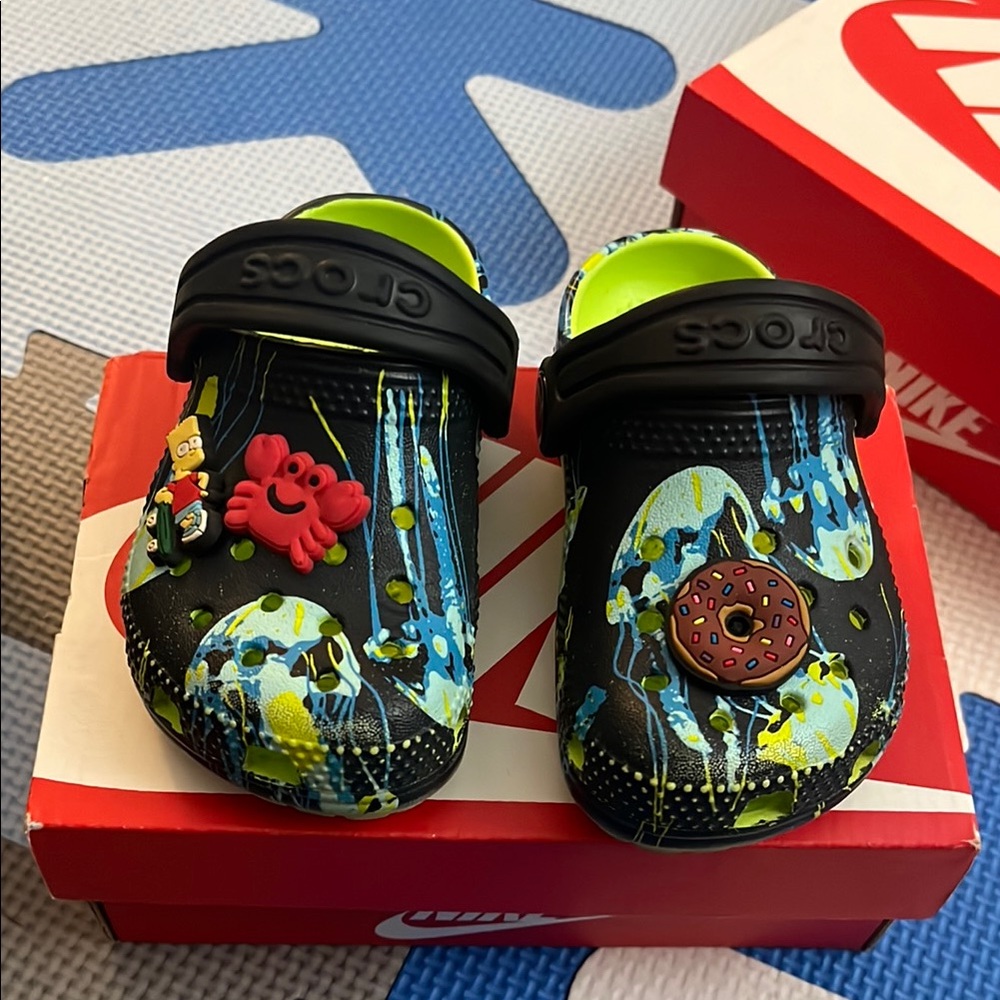 Crocs Black and Neon Green Clogs with Charms